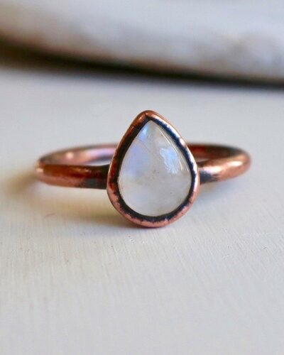 picture of a teardrop shaped moonstone copper ring